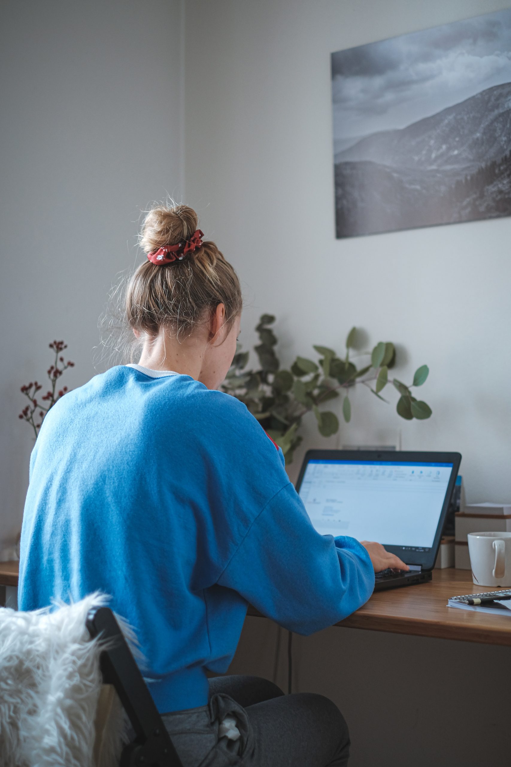 The young woman has a home office.